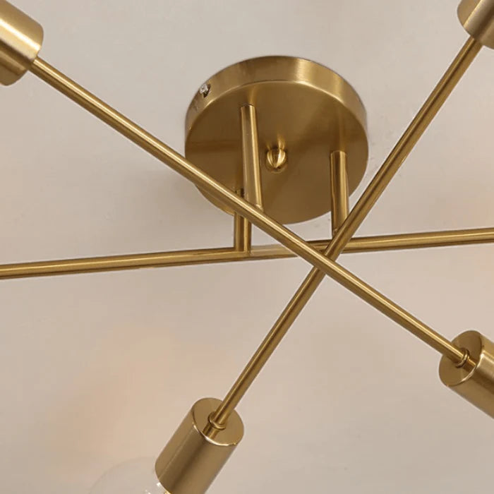 O Lustre Moderno Dourado com 6 Lâmpadas , uma obra de arte luminosa que redefine o luxo na iluminação. Da lojaorganizeja.com