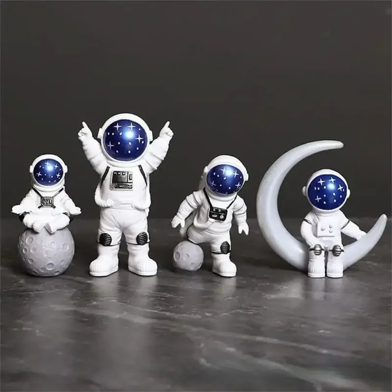 O Conjunto de 4 Peças de Esculturas Decorativas Astronauta traz a magia da exploração espacial diretamente para sua casa. Da lojaorganizeja.com