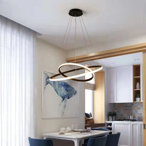 Transforme sua sala de estar ou jantar com a elegância moderna do Lustre Pendente Orbital Duplo em Led. Da lojaorganizeja.com