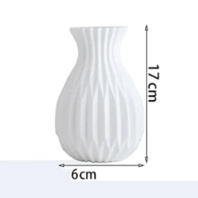  O Vaso Decorativo para Sala de Flor Nordic traz o charme e a simplicidade do estilo escandinavo para a sua mesa.  Da lojaorganizeja.com